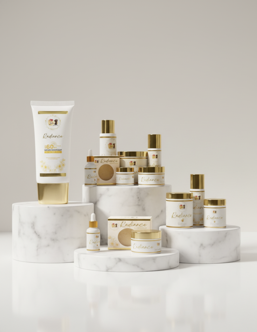 The complete Lakū Radiance routine on marble — face cream, body cream, body oil, scrub, soap, SPF 60